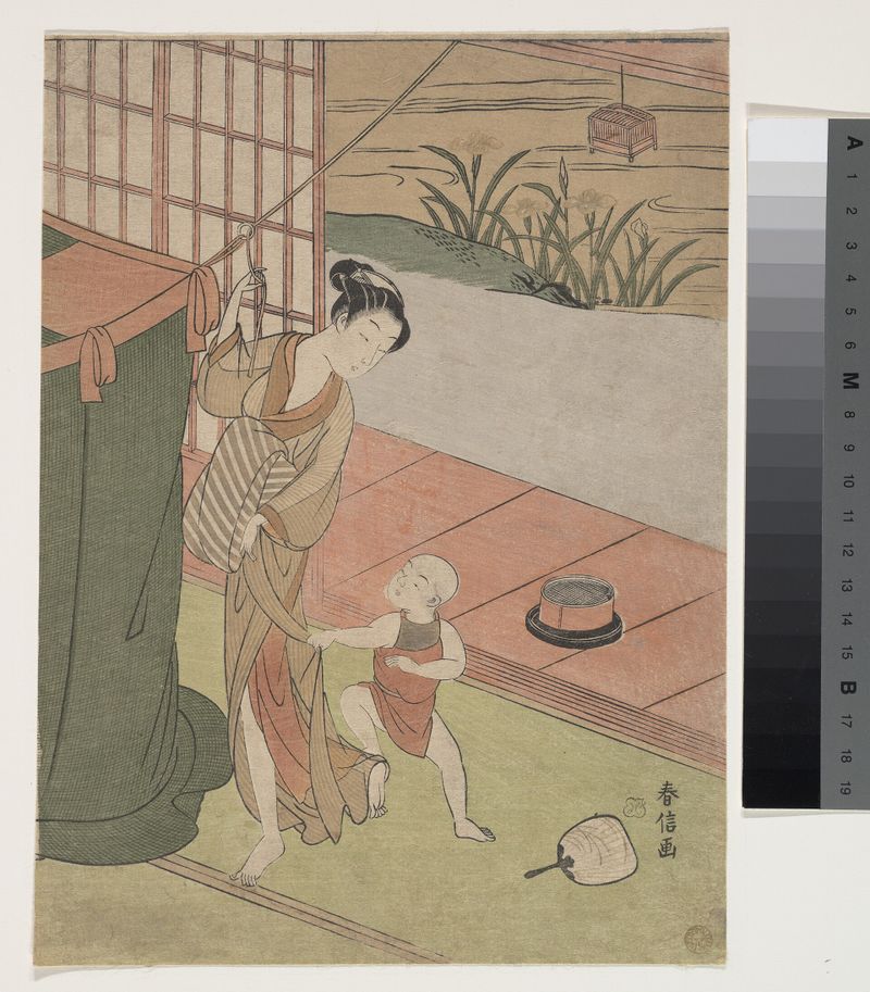 蚊帳を吊る母と子